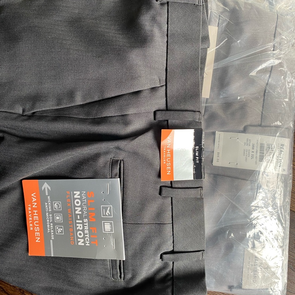 2 pairs of men’s travel friendly dress pants NWT. Both are 38x32.